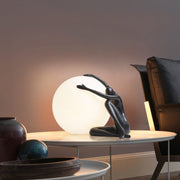 Humanoid Ball Holding Table Lamp