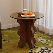 Artistic Round Glass Top Side Table with Sculpted Wood Base