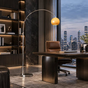 Sleek Adjustable Amber Glass Globe Arched Floor Lamp