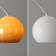 Sleek Adjustable Amber Glass Globe Arched Floor Lamp