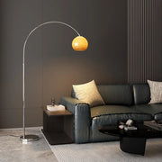 Sleek Adjustable Amber Glass Globe Arched Floor Lamp
